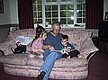 Grandpa reading to Gemma and Alexander