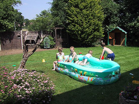Gemma and Alexander in the pool with James, Mathew and Ben